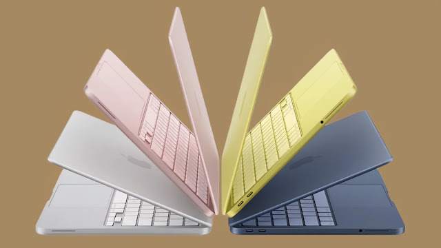 MacBook Neo بألوان Blush، Indigo، Silver وCitrus موضوعة على مكتب عصري