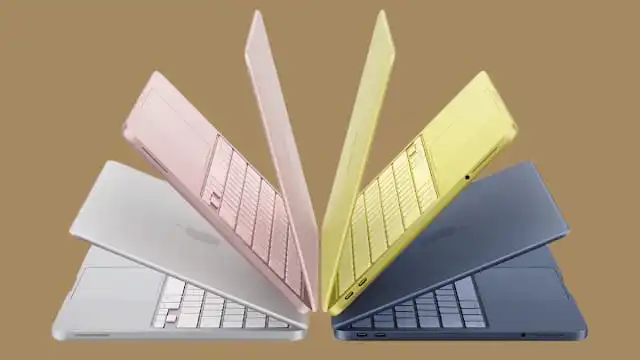 MacBook Neo بألوان Blush، Indigo، Silver وCitrus موضوعة على مكتب عصري